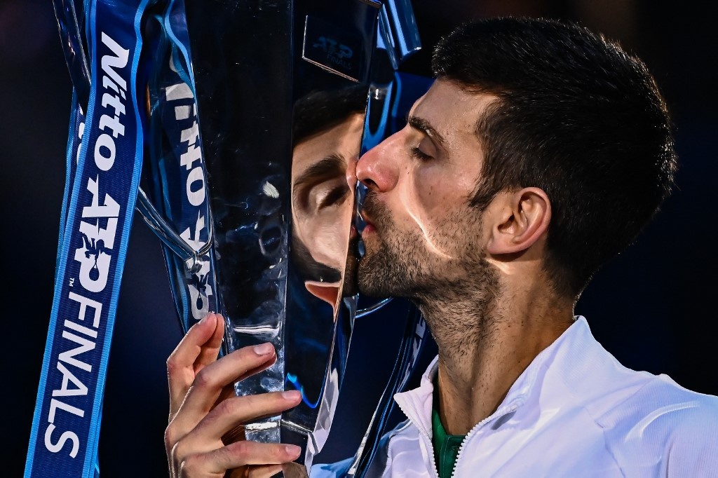 Serbia's Novak Djokovic kisses the winner's trophy after winning the men's single final match against Norway's Casper Ruud on November 20, 2022 at the ATP Finals tennis tournament in Turin. Photo Marco BERTORELLO / AFP