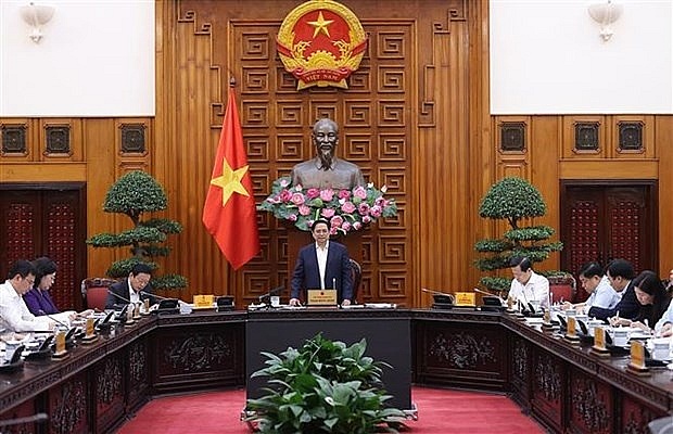 PM chairs meeting seeking ways to remove obstacles for production, business | Business | Vietnam+ (VietnamPlus)