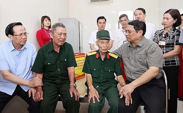 PM calls for joint efforts to take care of sick soldiers, war invalids, revolution contributors | Society | Vietnam+ (VietnamPlus)