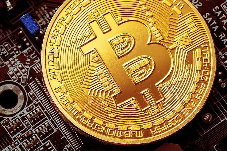 Bitcoin hits new record high of more than $75,000