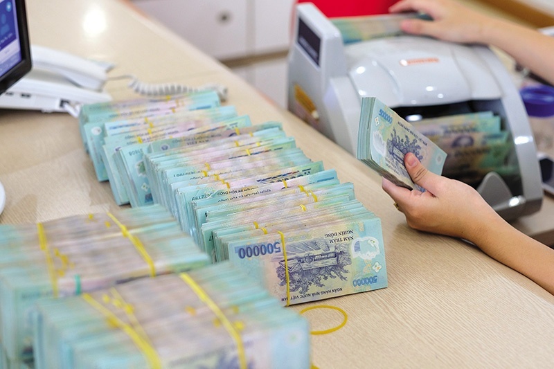 Bad debt growth at listed banks slows, but asset-quality risks persist