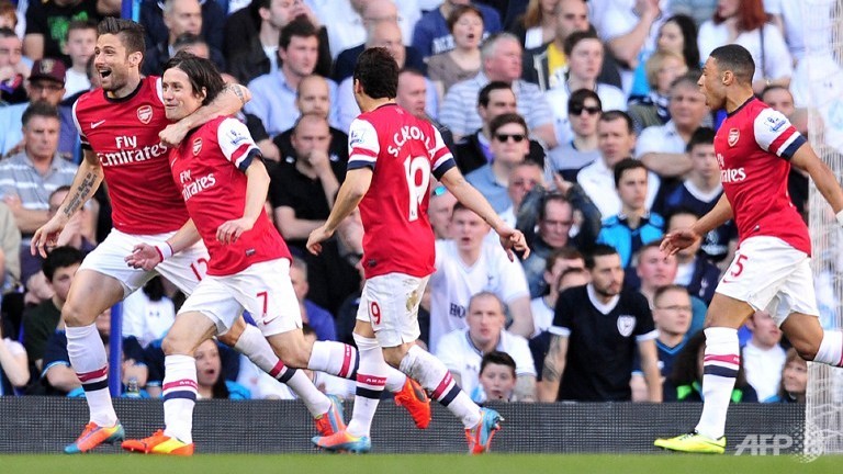 rosicky sinks spurs to boost arsenal title bid