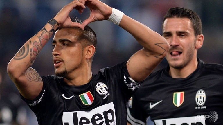 vidal double edges juventus closer to title