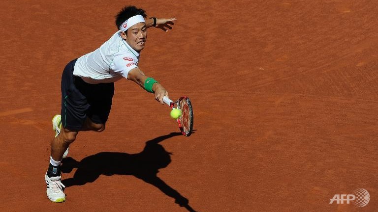 nishikori eases to barcelona open title