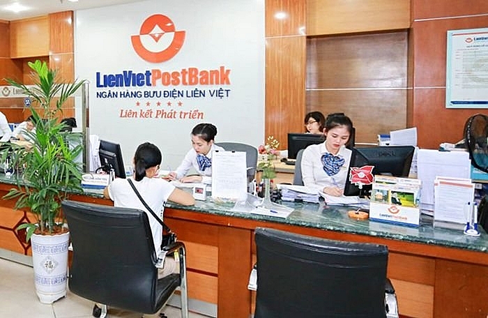 law on dual roles rearranges top bank personnel