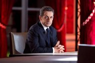 France's President Nicolas Sarkozy waits for the start of the one hour-long television interview at the presidential Elysee Palace in Paris. The French government halved its 2012 growth forecast, piling more pressure on Nicolas Sarkozy a day after the president unveiled a raft of measures he hopes will jumpstart the economy.