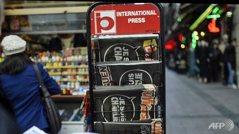 charlie hebdo flies off shelves as al qaeda claims attack