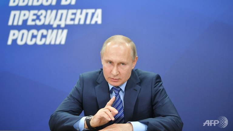 Putin promises minimum wage hike ahead of election