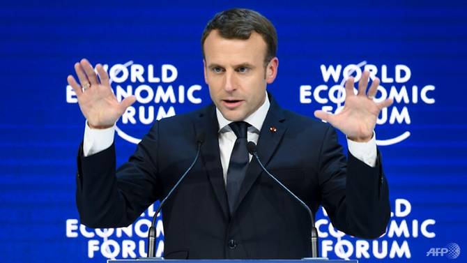 Davos hails Macron and Merkel's move to centre stage