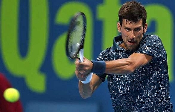 Djokovic eases to opening Qatar win, Thiem crashes out