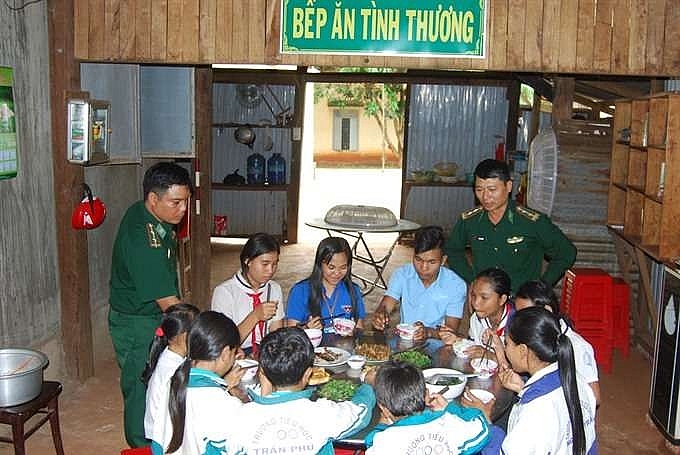 border guard soldiers help teach students