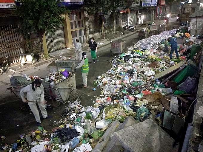 garbage piles up near nam son dump