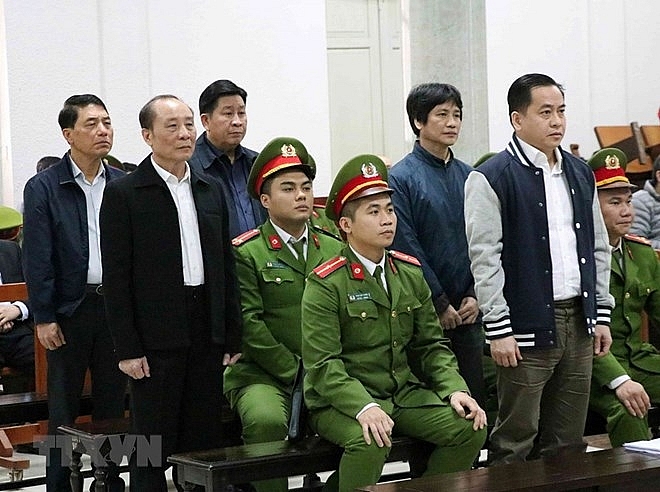 former public security officers brought to trial in hanoi