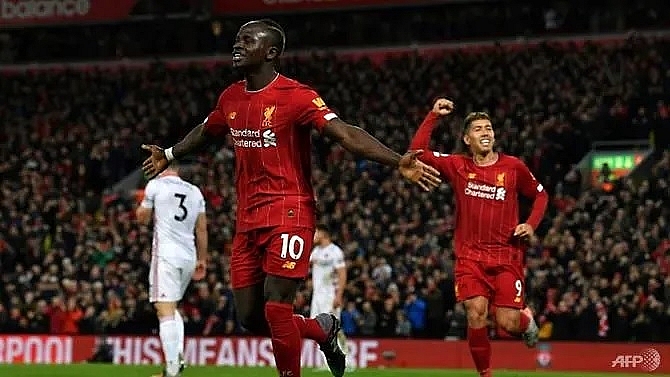 liverpool march towards history as top four race heats up