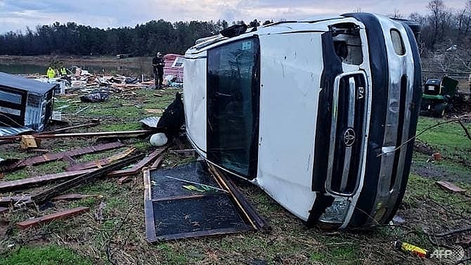 at least 11 dead as storms sweep through us south