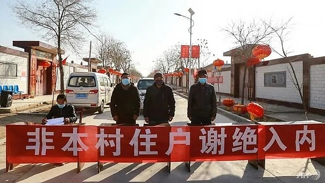 china virus fears prompt homemade barricades and online shaming