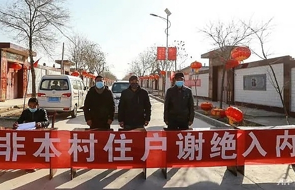 china virus fears prompt homemade barricades and online shaming