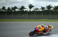 Australian Repsol Honda rider Casey Stoner takes a corner during the third and last day of a MotoGP pre-season testing session at the Sepang circuit outside Kuala Lumpur on February 2. World champion Stoner broke the Sepang circuit MotoGP lap record -- albeit unofficially -- on Thursday as he once again set the pace on the final day of testing of the new 1,000cc bikes. 