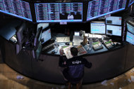 A trader on the floor of the New York Stock Exchange on February 3. US stocks closed in positive territory Tuesday, clawing back from losses after reports that Greece was nearing a bailout deal to avoid defaulting on its debt.