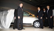 Renault chief executive Carlos Ghosn (3rd R) and Renault's new factory manager in Morocco, Tunc Basegmez, unveil Renault's new model 