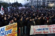Demonstrators march in Athens to protest austerity cuts. Eurozone finance ministers put off a decision on a new bailout to save Greece from bankruptcy, giving Athens less than a week to meet three conditions in return for 130 billion euros in aid.
