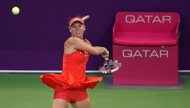 Caroline Wozniacki of Denmark plays against Lucie Safarova of the Czech Republic during the third day of the WTA Qatar Open in Doha. Wozniacki crashed out of the Qatar Open, squandering three match points in a 4-6, 6-4, 7-6 (7/3) defeat to Safarova. 