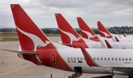 Australia's flagship carrier Qantas said it would cut jobs as it unveiled an 83 percent slump in profit Thursday due to industrial action and spiralling fuel costs