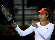 Serbian tennis player Ana Ivanovic reacts after winning a point against Francesca Schiavone of Italy during their Dubai WTA Open tennis match in the Gulf emirate. Ivanovic upset the seedings in a battle of former French Open champions with Francesca Schiavione at the Dubai Open on Tuesday, insisting afterwards that there is still another Grand Slam title left in her.