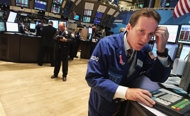 US markets close flat after Dow jumps past 13,000
