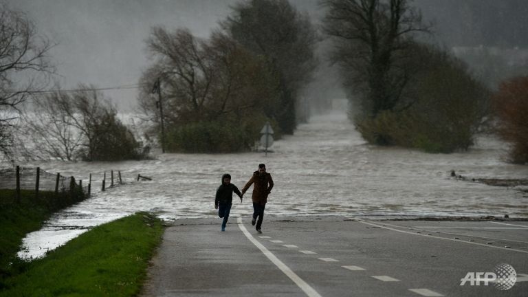 one dead in portugal floods as cyclist swept away