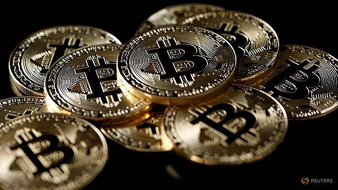 bitcoin bounces back from three month low in volatile trade