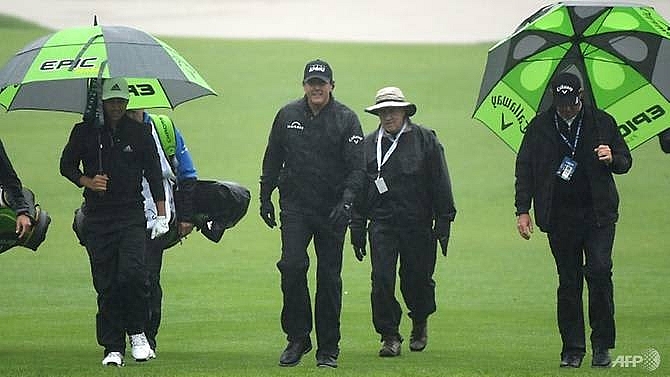 mickelson woods on hold as rain delays play at riviera