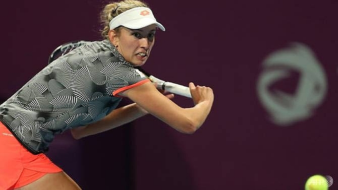 mertens shrugs off back pain to beat halep for qatar open title