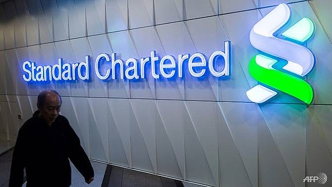 standard chartereds 2018 profits rise despite setting aside cash for fines