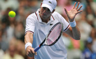Top seed John Isner, pictured in January, saved all five break points he faced en route to a 6-3, 6-4 win over Ryan Sweeting in the second round of the Delray Beach Tennis Championships. 