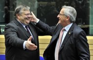Greek Finance Minister Evangelos Venizelos (L) salutes Luxembourg Prime Minister and Eurogroup president Jean-Claude Juncker before a meeting at the EU headquarters in Brussels. Greece's debts run to 350 billion euros ($466 billion) and the eurozone rescue package will throw 237 billion euros at the problem, with top-up aid from the International Monetary Fund. 