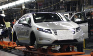 Workers assemble the Chevy Volt electric vehicle in Hamtramck, Michigan in 2011. General Motors said Friday it has suspended production of its electric Chevy Volt for five weeks in order to match supply to weak demand. 