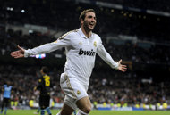 Real Madrid's Argentinian forward Gonzalo Higuain celebrates after scoring against Espanyol during a Spanish league football match at the Santiago Bernabeu stadium in Madrid. Real Madrid crushed Espanyol 5-0 on Sunday to record a 10th straight league victory and restore their 10-point advantage over Barcelona at the top of La Liga.