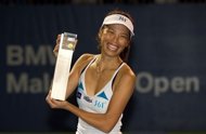 Hsieh Su-Wei of Taiwan poses with her trophy after defeating Petra Martic of Croatia during their final singles match at the BMW Malaysian Open women's tennis tournament in Kuala Lumpur. Hsieh won the match when Martic retired due to injury