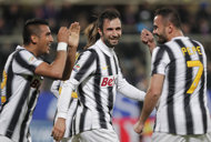 (From L) Juventus' Arturo Vidal, Mirko Vulcinic and Simone Pepe celebrate after scoring during a recent football match in Florence, on March 17. Juventus' next game is on Tuesday in Turin, their Coppa Italia 2nd leg semi-final against AC Milan. Juve lead 2-1 from first leg.