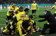 Dortmund's players celebrate after scoring a goal during their German Football League DFB Cup semi-final match against SpVgg Greuther Fuerth in Fuerth, southern Germany, on March 20. Having both secured their places in the Cup final in midweek, Bundesliga rivals Bayern Munich and Dortmund resume their battle for the league title this weekend.