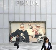 Pedestrians walk in front of the luxury shop of Prada in Chengdu, the capital of China's southwestern province of Sichuan in 2011. Italian luxury design house Prada said Thursday its net profit soared 72.2 percent in the year ending January 2012, driven by strong retail sales especially in Asia