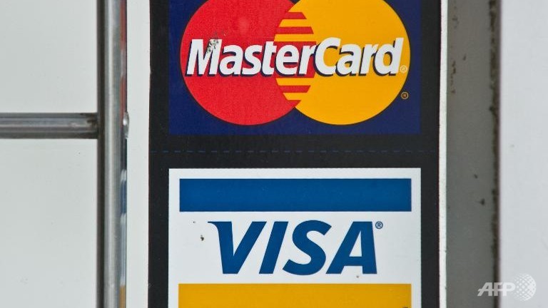 Visa, Mastercard block transactions for sanctioned banks