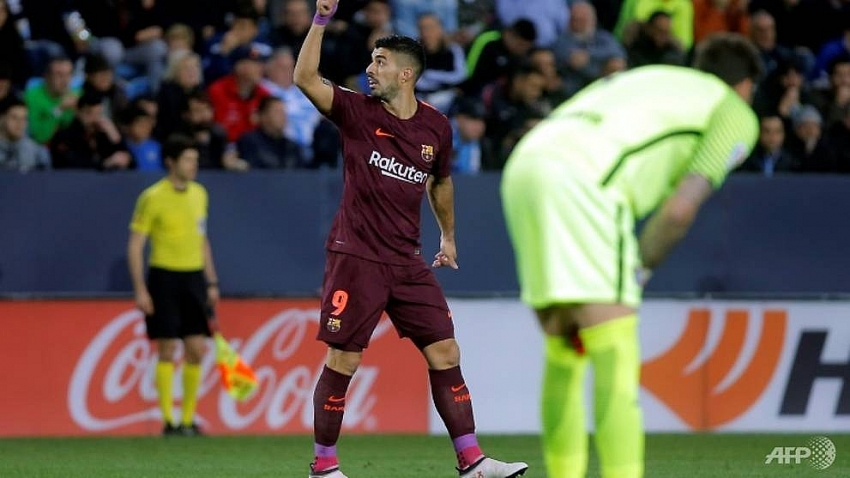 barcelona stroll past malaga without messi