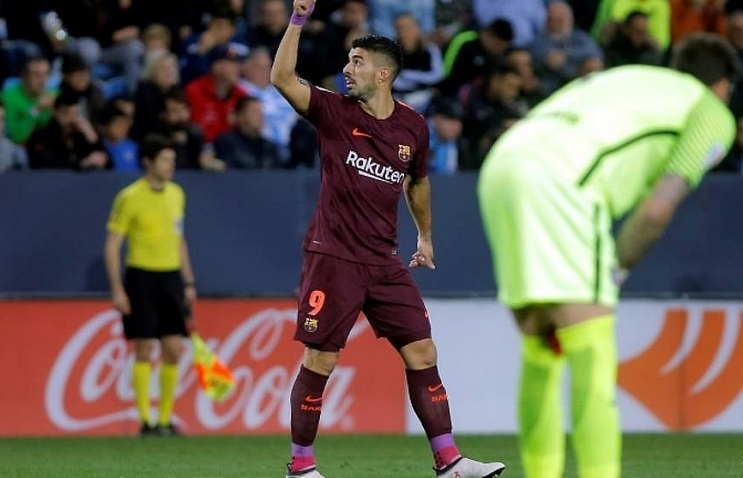 Barcelona stroll past Malaga without Messi