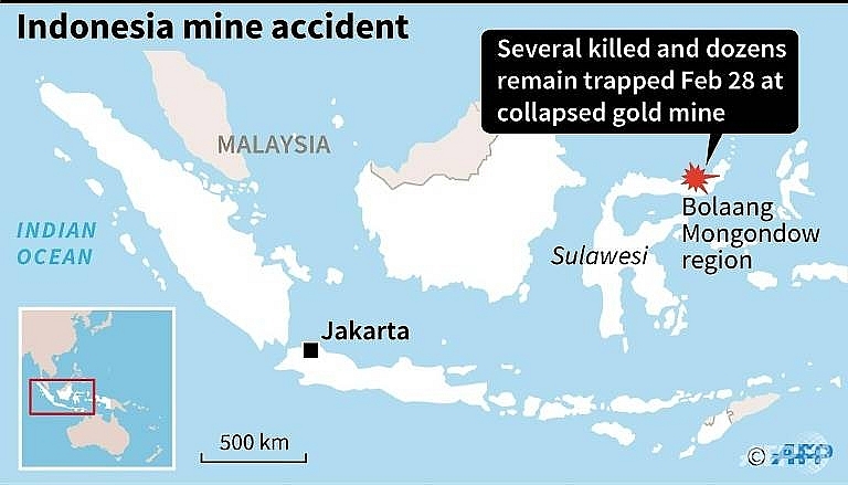 eight dead in indonesia mine collapse as excavator digs for survivors