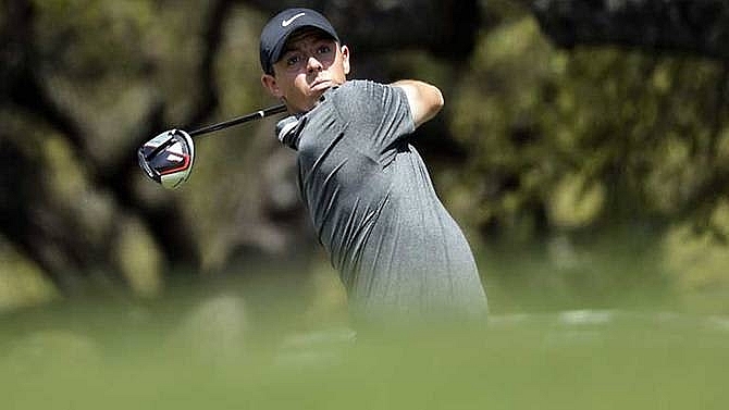 mcilroy wins tiger falls day ousted at wgc match play