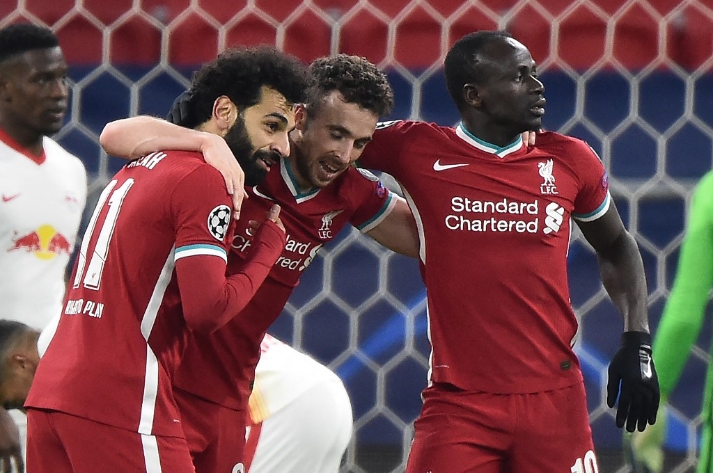 liverpool switch off domestic woes to ease into champions league last eight