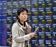 Asian markets edged lower in limited holiday trade on Monday after weaker-than-expected US jobs data hit market sentiment while rising inflation in China also weighed on investors