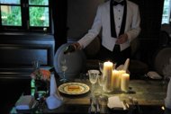 A waiter pours white wine into a glass to demonstrate the Hullett House hotel's recreation of the Titanic's last meal to mark the disaster's 100th anniversary in Hong Kong. The diners will be served by waiters dressed in uniforms like those on the Titanic and eat off fine bone china plates as used on board